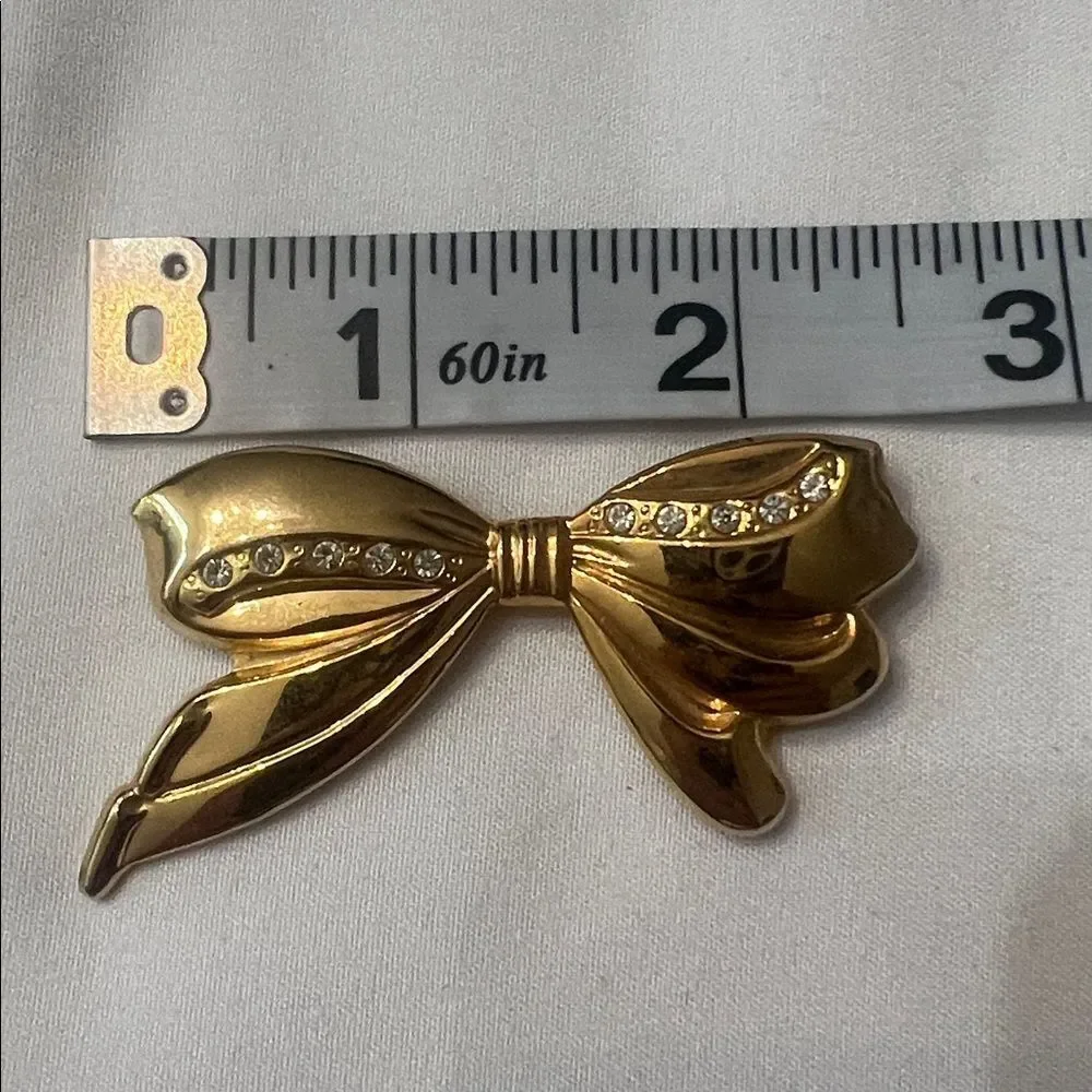 Vintage bow shaped pin with crystal accents EVC perfect for a lapel or scarf